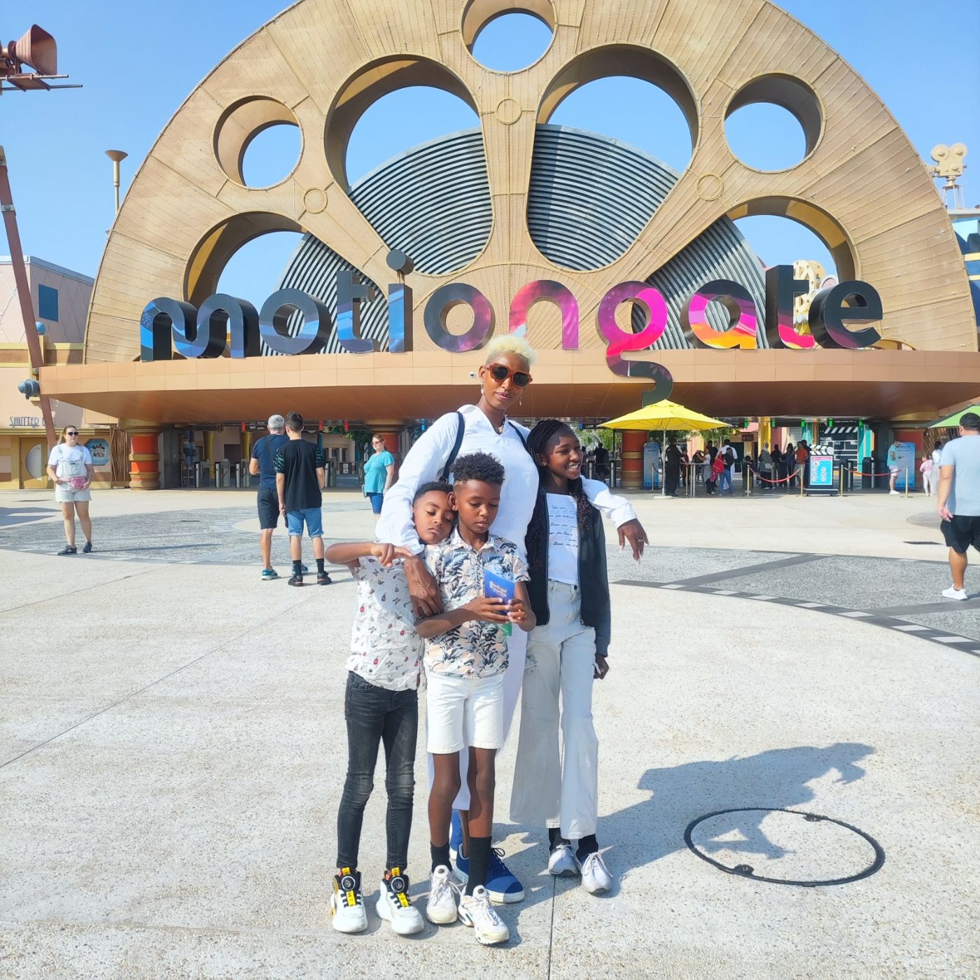An adult and three children outside MOTIONGATE Dubai.